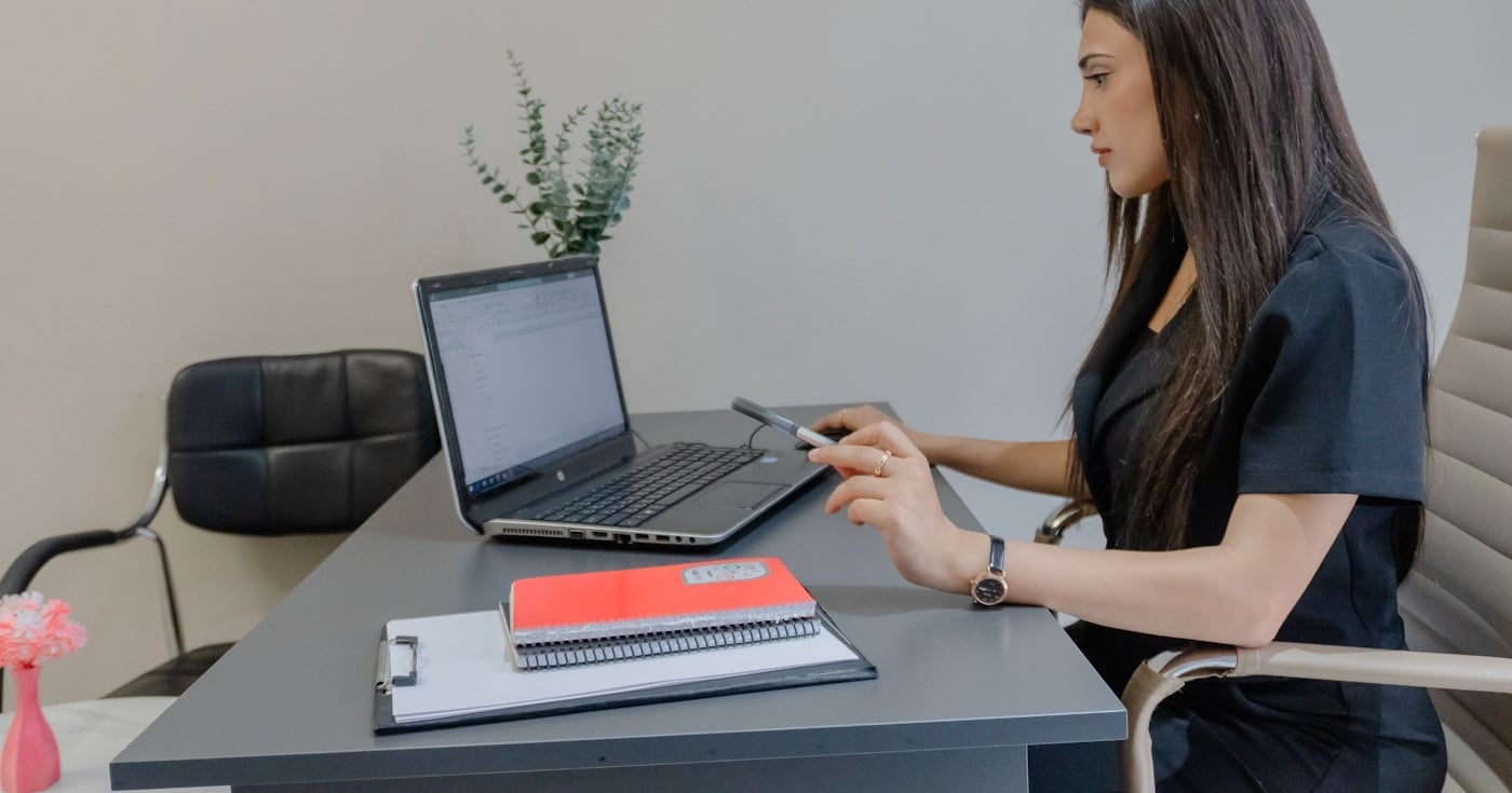 Content writer working on laptop at desk