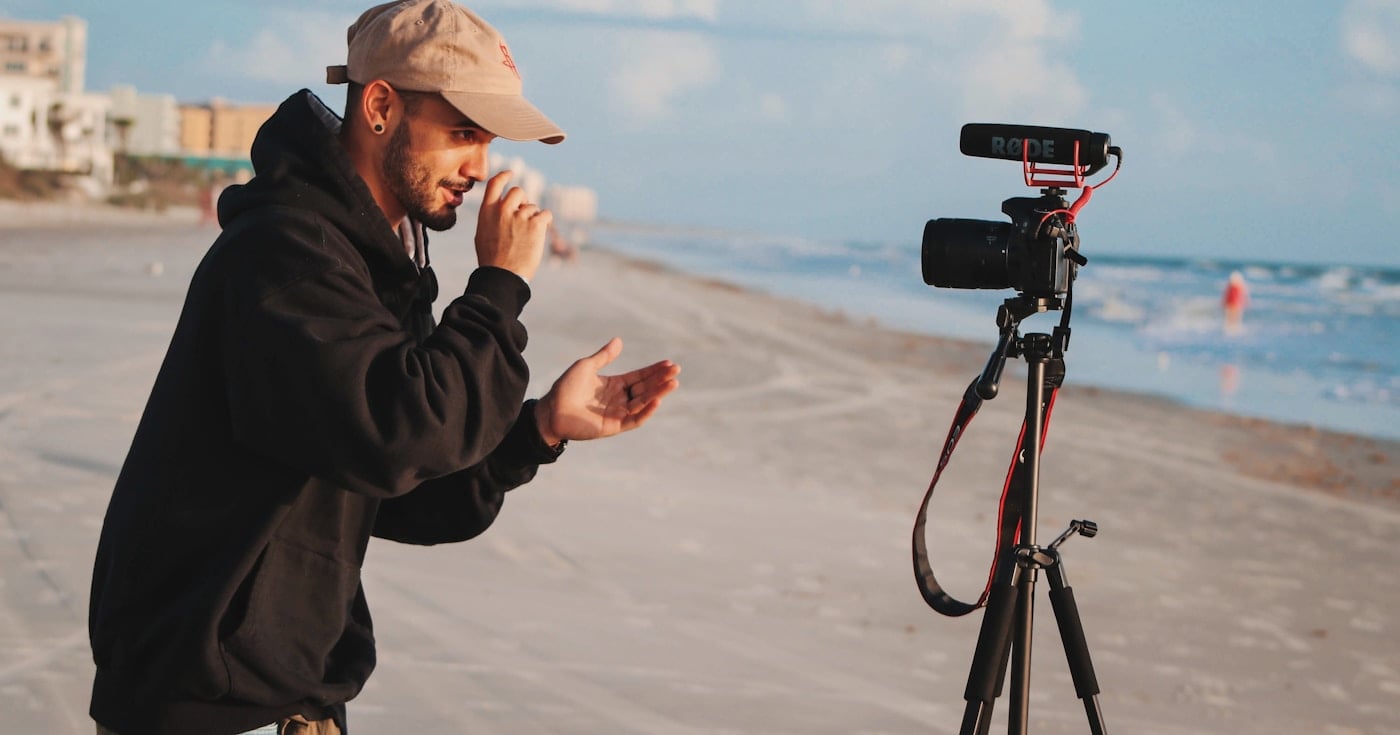 Person holding camera ready to create content