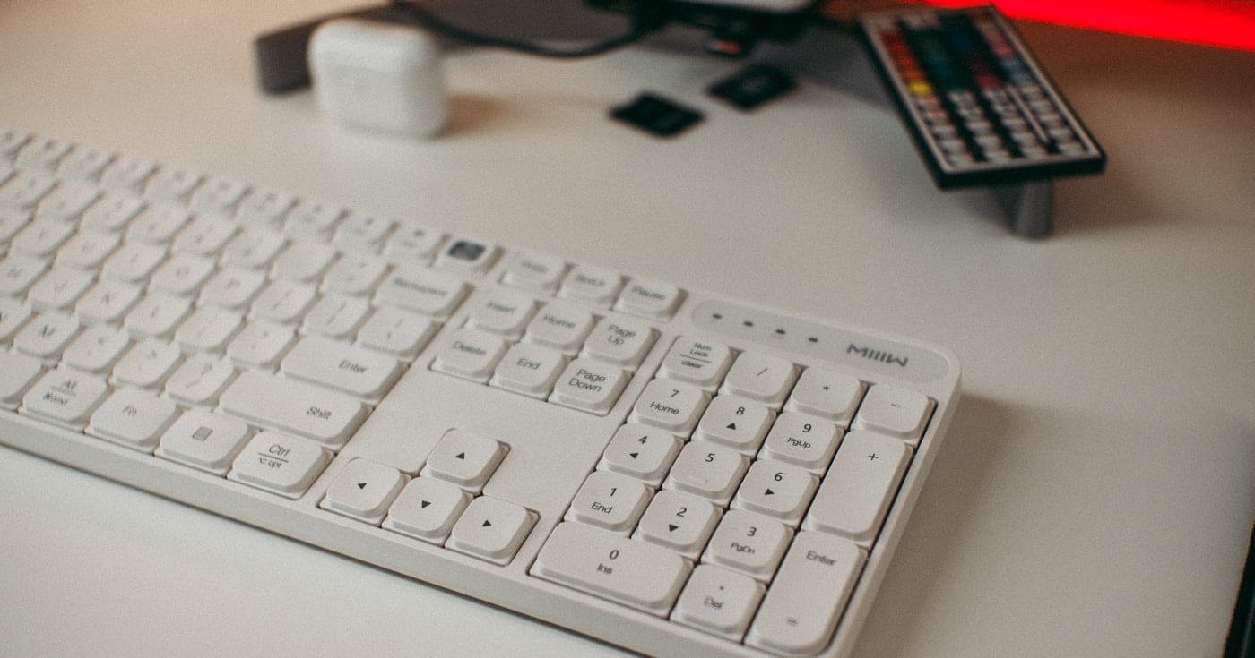 Slim wireless membrane keyboard on a desk
