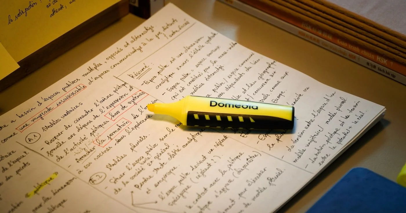 Handwritten notes with yellow highlighter — comma splice grammar guide